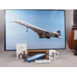 A British Airways model of Concorde, a Concorde related glass dish, a Concorde framed print and