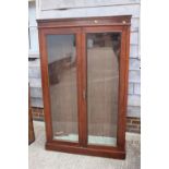 A late 19th century mahogany bookcase enclosed two glazed panel doors, fitted five adjustable