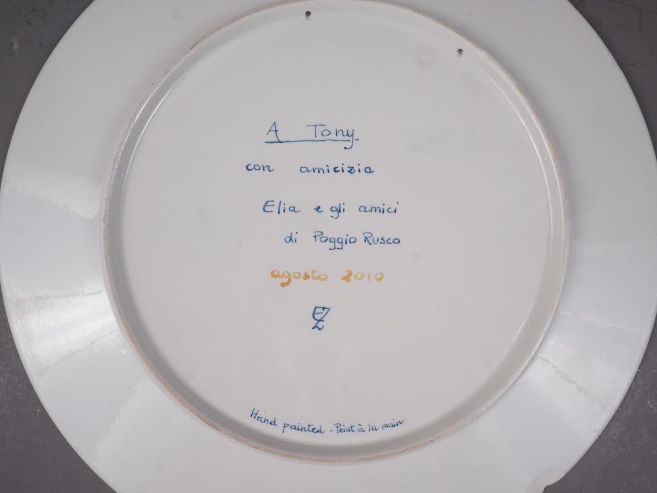 An Italian plate, decorated with a nude woman playing the violin (chip to rim) - Image 2 of 3