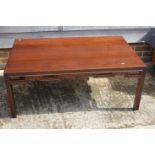 A Chinese carved hardwood low occasional table, on scroll supports, 28 1/2" wide x 46 1/2" long x 18
