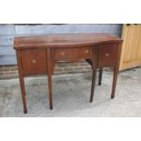 A mahogany, banded and line inlaid serpentine front sideboard of Georgian design, fitted one