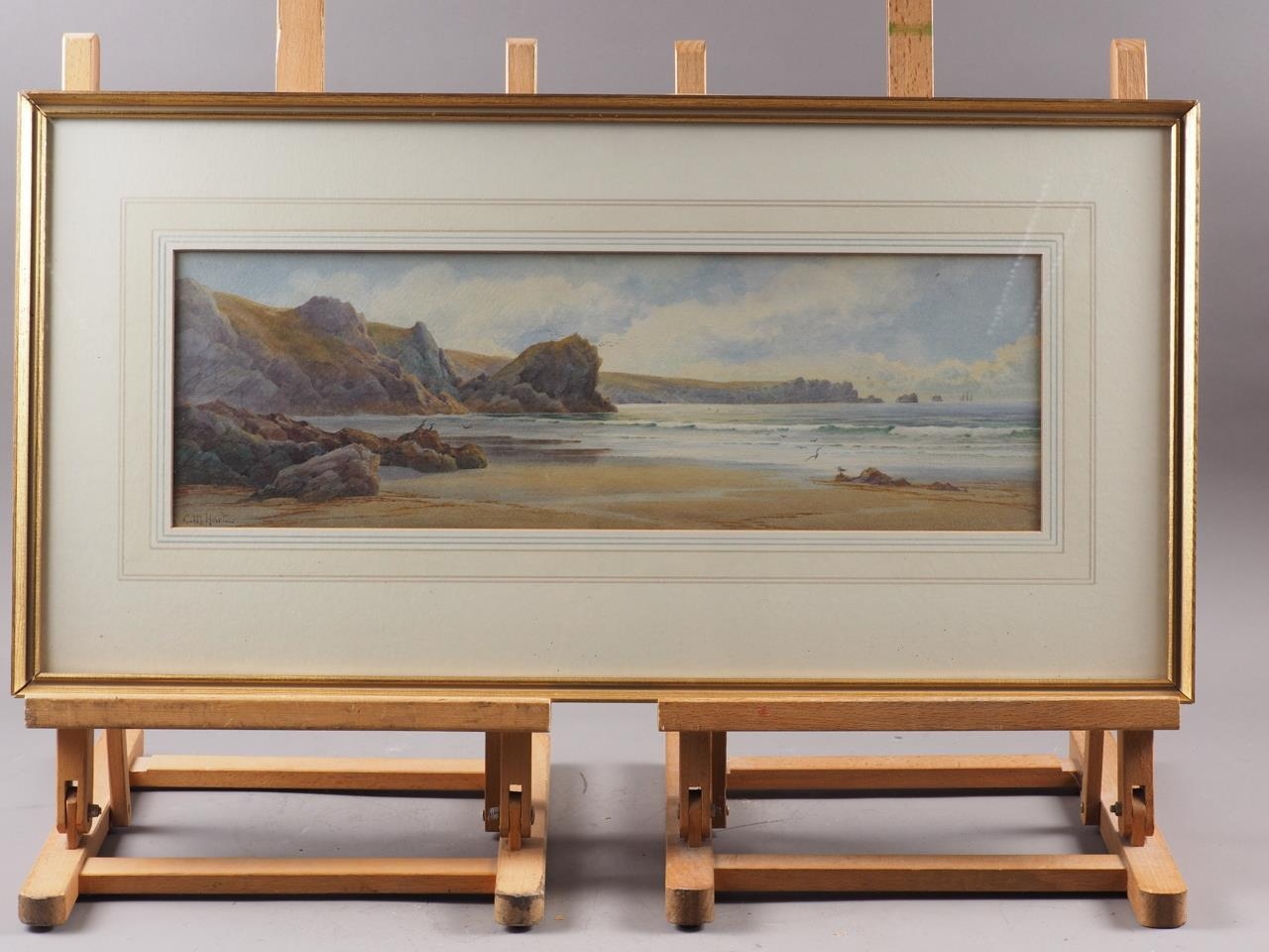 C M Hart: watercolours, "The Lion Rock and Lizard Head Kinance Cove", 6 1/4" x 20 1/2", in wash line