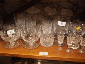 A set of four Tudor cut glass grapefruit dishes, a set of four brandy balloons, whisky tumblers