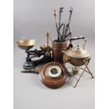 A pair of brass fire bellows with figure decoration, a brass kettle, on stand, a balance with