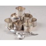 Eight silver napkin rings, various, two silver salt spoons, 6oz troy approx, and three other white