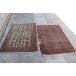 A Middle Eastern prayer rug with geometric designs and star design borders, in shades of natural