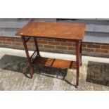 An early 20th century walnut two-tier occasional table, on castored splay supports, 30" wide x 15"