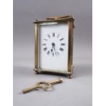 A brass cased carriage clock with white enamel dial and Roman numerals, 4 1/2" high, in leather