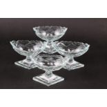 A set of four Georgian design cut glass salts, on diamond bases, 4" wide