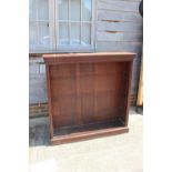 A late 19th century mahogany open bookcase with ovolo cornice over three adjustable shelves, on