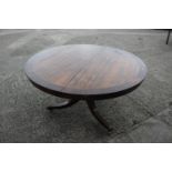 A Regency/William IV rosewood and banded brass inlaid circular top table, on turned column and