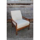 A 1960s/70s teak armchair, upholstered in a cream fabric