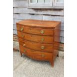 A 19th century mahogany and line inlaid bowfront chest of four long drawers, on splayed bracket