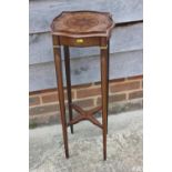 An Edwardian Sheraton design mahogany and marquetry brass mounted shape top urn stand, fitted single