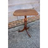 A late 19th century mahogany rectangular top occasional table, on turned column and tripod splay