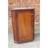 A mahogany corner hanging cupboard enclosed panel door, 20" wide x 13" deep x 28 1/2" high, an early