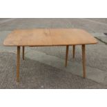 An Ercol 444 light elm extending dining table, on splay supports, 60" x 34" x 28" high