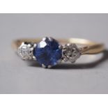An 18ct gold, sapphire and diamond three-stone dress ring, size N, 1.9g