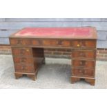 A Victorian mahogany double pedestal desk, inset red leather top over nine drawers, 53? wide x 26?