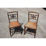 A pair of 19th century grained as rosewood and brass bound bedroom chairs with brown leather