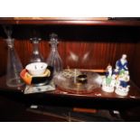 Three clear glass decanters, three studio pottery dishes, a glass two-tone shaped bowl, a brass door
