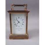A Matthew Norman brass cased carriage clock with white enamel dial and Roman numerals, 4 3/4" high