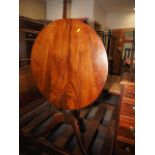 A 19th century mahogany circular tilt top occasional table, on turned column and tripod splay