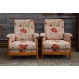 A pair of Ercol showframe armchairs with loose seat and back cushions