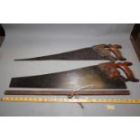 A Disston vintage 26" panel saw and a similar saw