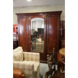 A Holland and Sons 19th century figured mahogany linen press/wardrobe enclosed mirror door and two