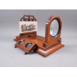 A 19th century table top adjustable stereoscope and photographic viewer (graphoscope) of compact