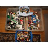 A quantity of Lego building blocks, and a smaller quantity of PlayMobil figures and toys