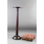 A carved mahogany jardiniere stand, 32" high, and a carriage warming stool with heated liner