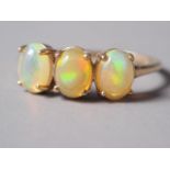 A 9ct gold opal three-stone dress ring, size Q, 2.1g