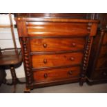 A 19th century mahogany chest of four long graduated drawers with knob handles and flanking split