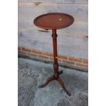 A turned mahogany jardiniere stand, on carved tripod splay supports, 14" dia x 37" high, and two