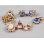 A pair of earrings and matching pendant, set coral and white stones, and a similar, set blue and
