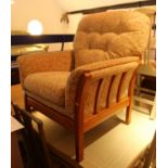An Ercol ash deep seat arm easy chair with loose seat and back cushions