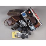 An Exa Exakta camera, a Kodak Retina II camera and various other cameras and accessories