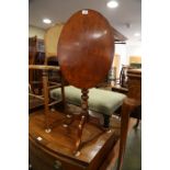 A 19th century mahogany oval tilt top occasional table, on bobbin turned tripod splay support, 21"