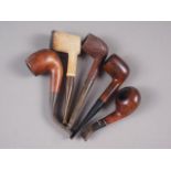 A Meerschaum pipe and four other briar wood pipes