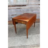 A mahogany Pembroke dining table, fitted one drawer, on square taper supports, 41" wide x 26" deep x