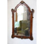 A 19th century walnut and gilded shape top wall mirror, 30" x 17 1/2" overall