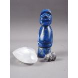 A carved lapis lazuli totem figure, 5 1/4" high, a piece of rock crystal, formed as a heart, 2 1/