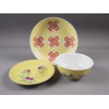 A Chinese yellow glazed bowl with interior bat decoration and exterior chrysanthemum decoration,