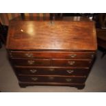 A 19th century mahogany fall front bureau, fitted one long drawer over two short drawers and two