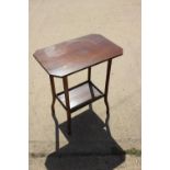 A mahogany octagonal top two-tier occasional table, 26" wide, and a spinning stool