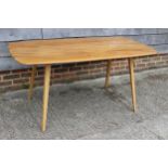 An Ercol elm 382 dining table, on turned supports, 60" wide x 30" deep x 28" high