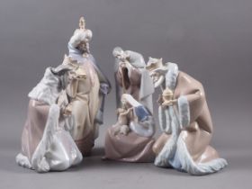 A Lladro Nativity group, Mary, Joseph and Jesus, 10" high, and three Lladro figures, the three