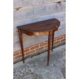 A mahogany 'D' shaped console table, 29" wide, an oval pie crust occasional table, on tripod